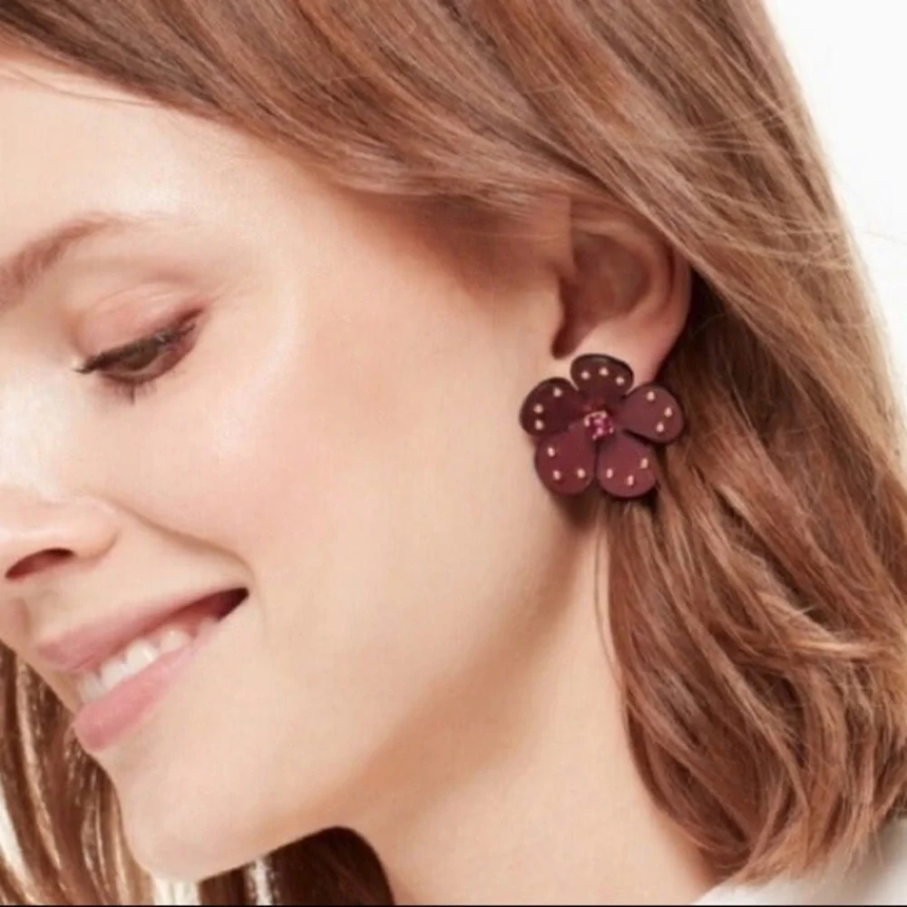 Kate Spade flower earrings. Burgundy leather with pink crystal centers. New!